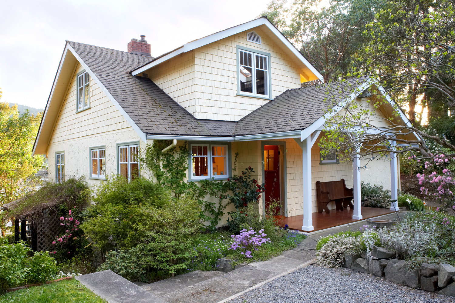 The exterior of a light yellow house